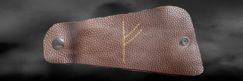 İyi şanslar muskası olarak derideki Fehu runesi